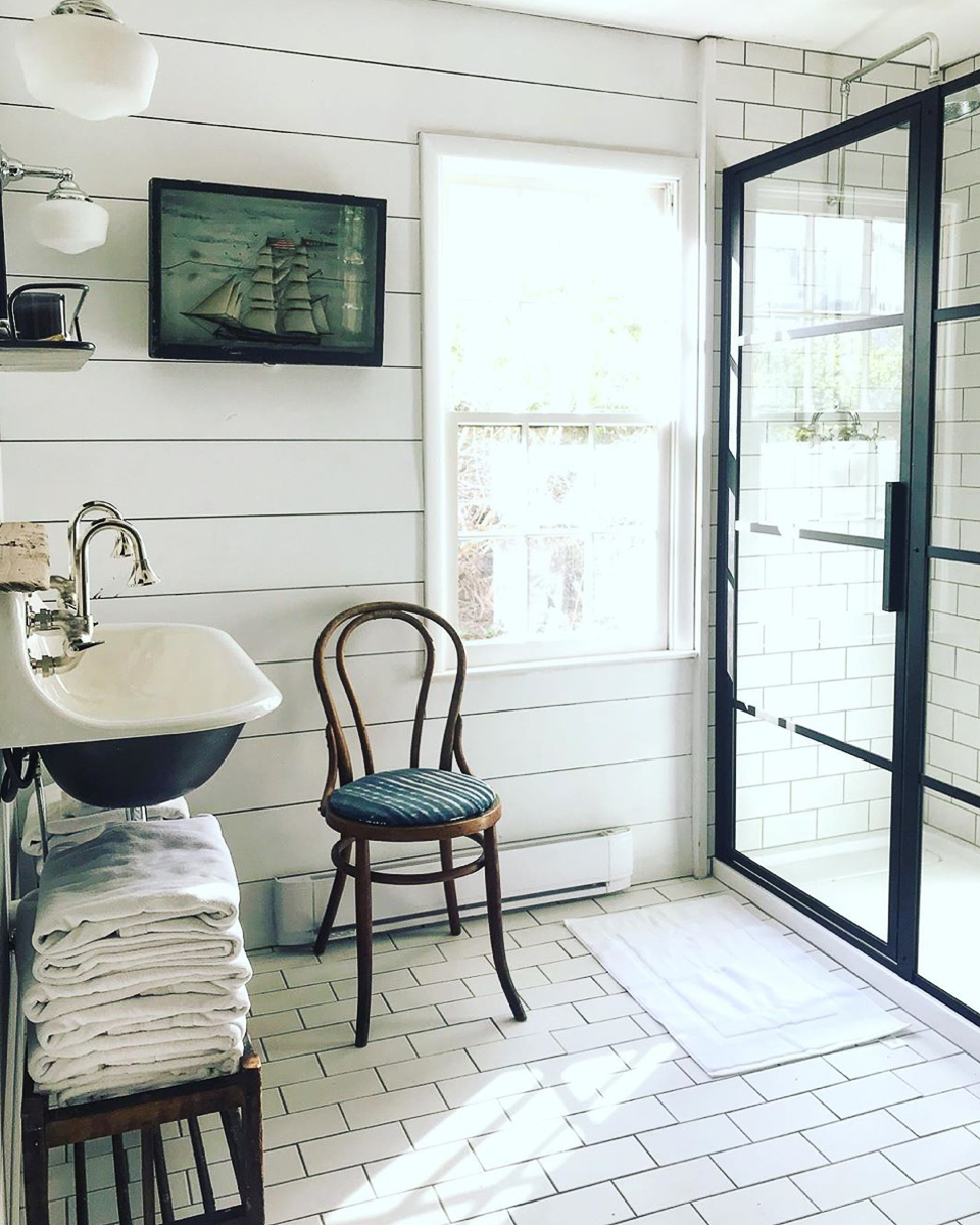 Classic subway tile is unexpected on the floor of this charming cottage kellyelko.com