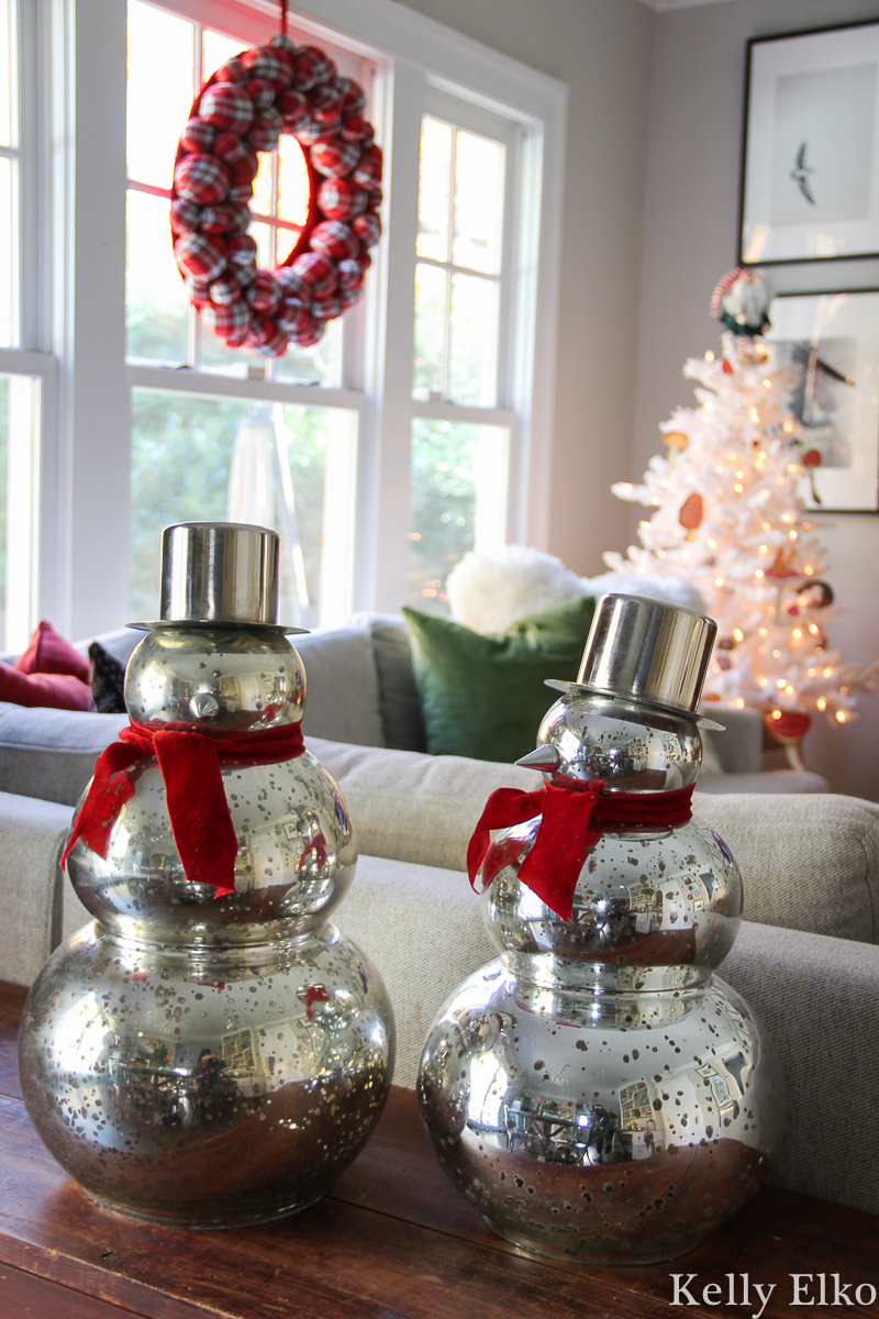 Beautiful Christmas home tour - love the mercury glass snowman kellyelko.com #mercuryglass #snowman #christmasdecor #colorfulchristmas #farmhousechristmas #christmaswreath #christmashometour #whitechristmastree