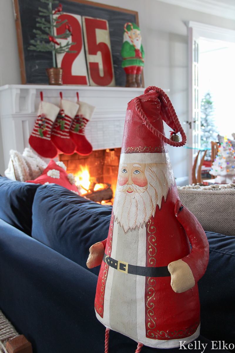 Love this fun and colorful Christmas home tour filled with vintage decorations kellyelko.com #christmasdecor #christmasdecorations #santa #vintagechristmas #retrochristmas #christmasmantel #christmashometour 