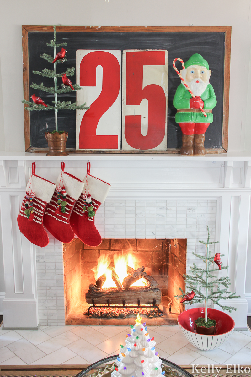 Home Sweet Home Christmas Home Tour - love the blow mold elf and the metal numbers on this retro Christmas mantel kellyelko.com #christmas #christmashometour #christmastour #vintagechristmas #retrochristmas #colorfulchristmas #christmasmantel #farmhousechristmas