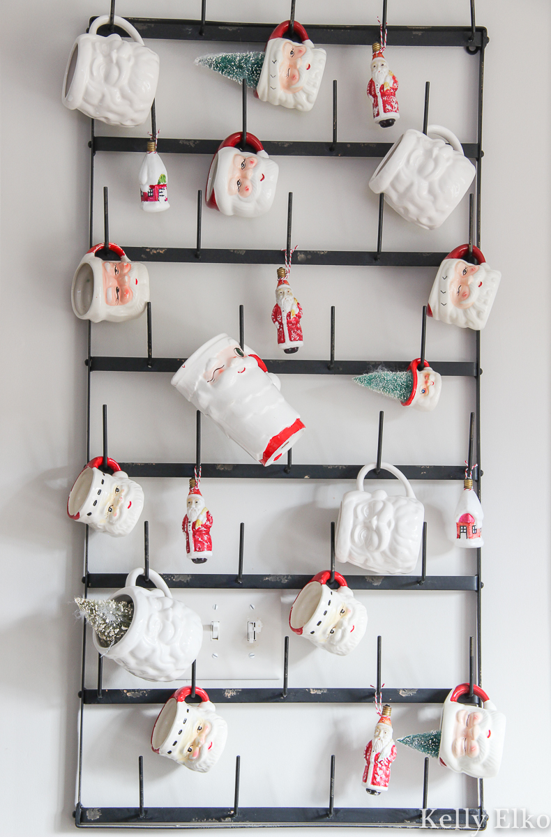 Love this display of Santa mugs hanging on a huge bottle drying rack / kellyelko.com 