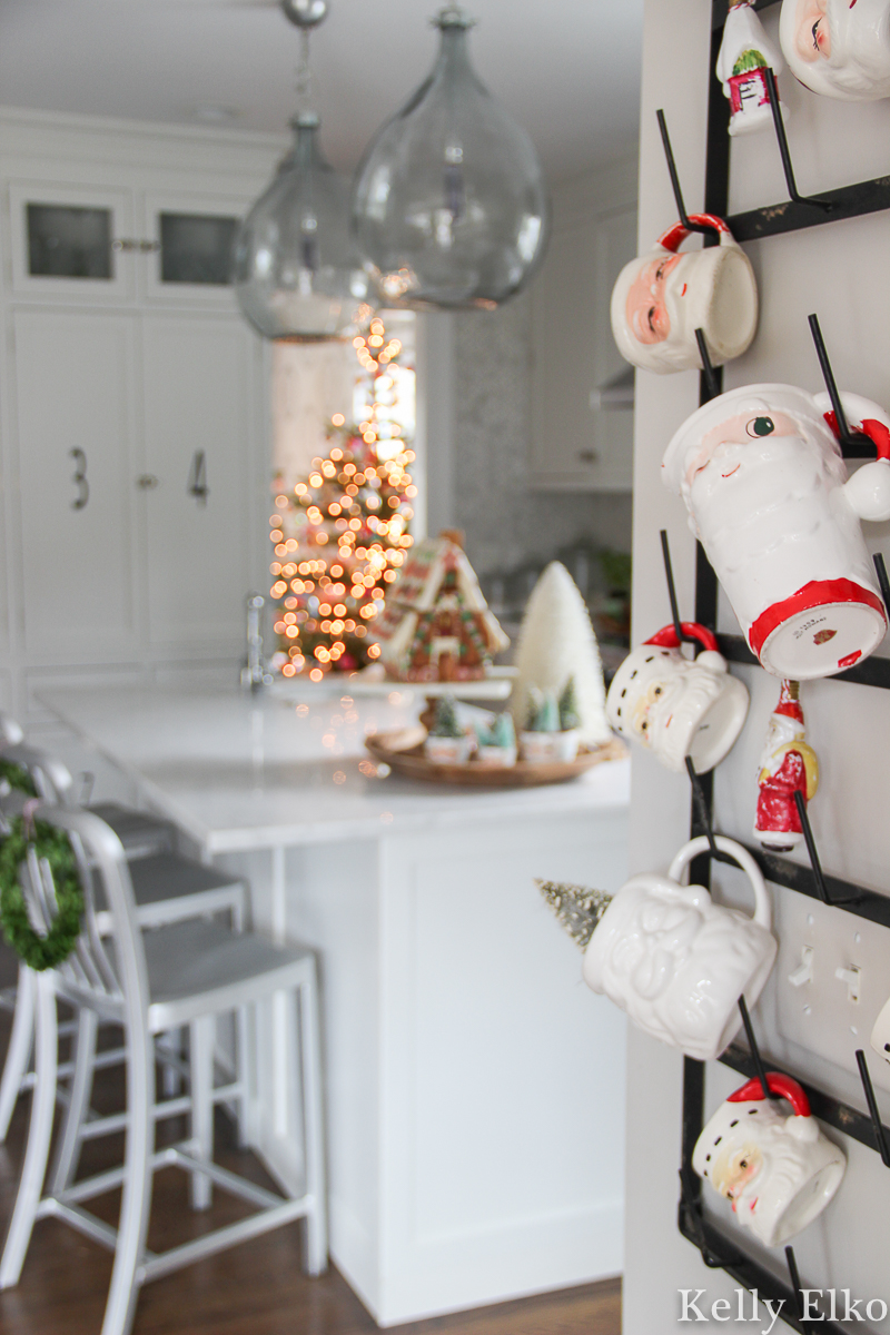 Collection of Santa mugs displayed in the kitchen kellyelko.com