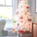 Love this white Christmas tree with DIY mushroom ornaments kellyelko.com #christmas #christmasornaments #retrochristmas #christmascrafts