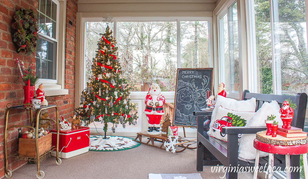 Love this fun retro Christmas porch with Santa blow mold and vintage finds #christmas #christmasporch #vintagechristmas #retrochristmas #outdoorchristmasdecor 