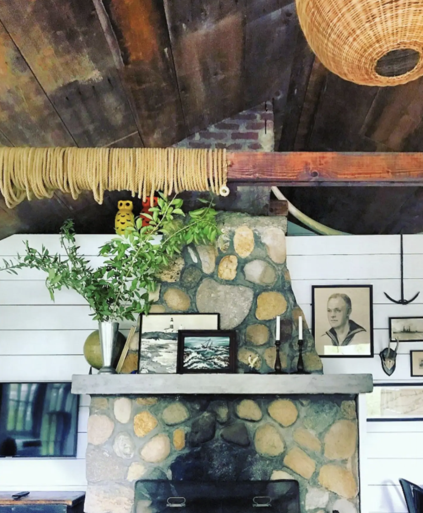 Rustic stone mantel in this charming cottage kellyelko.com