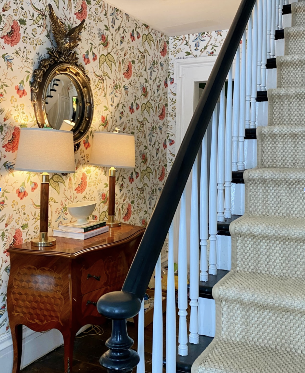 Beautiful foyer with colorful floral wallpaper in this 200 year old farmhouse