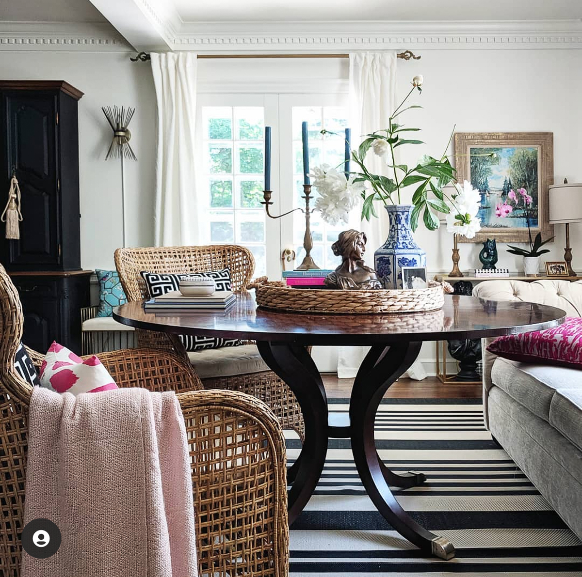 Beautiful sunroom with game table and wicker chairs