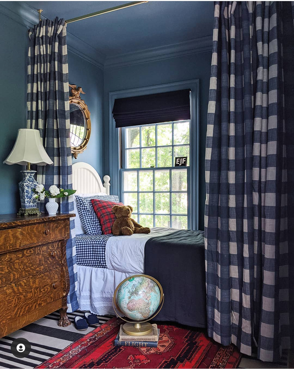 Create a cozy sleeping nook for a kids room - love the dark blue paint