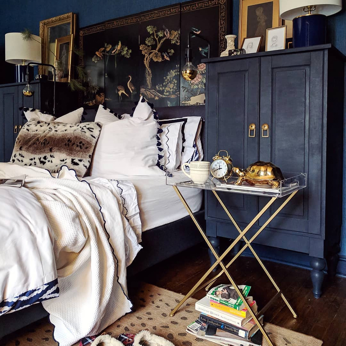 Cozy dark blue bedroom with vintage touches