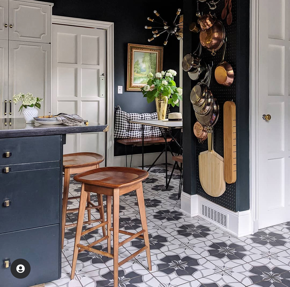Tour this vintage modern home with a beautifully renovated kitchen with dramatic dark blue walls and copper pot collection