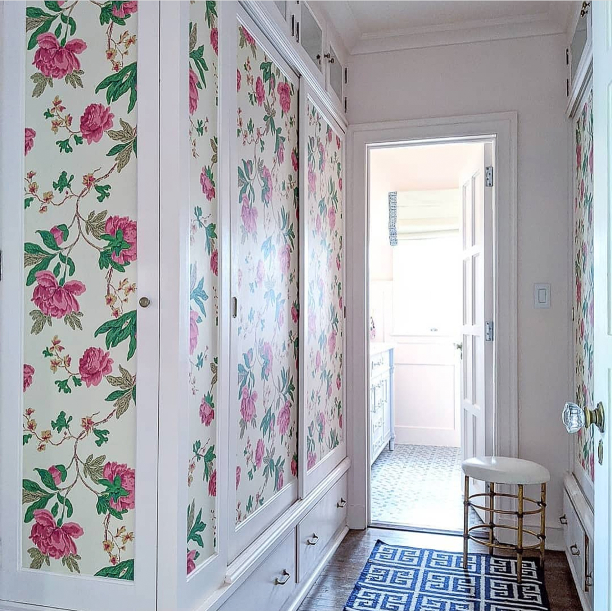 Old house with original linen closet wallpapered in a lovely floral 