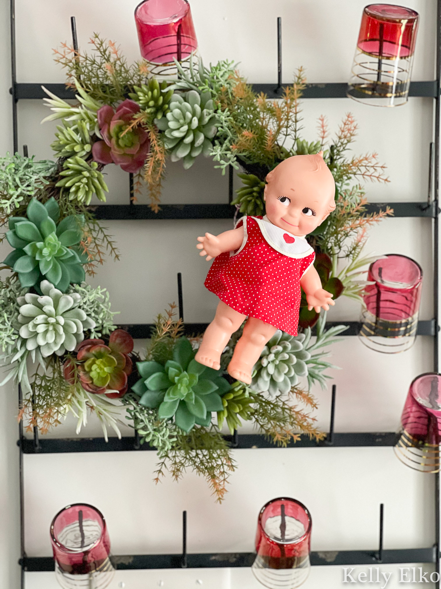 Love this adorable little vintage Kewpie doll on a succulent wreath kellyelko.com 