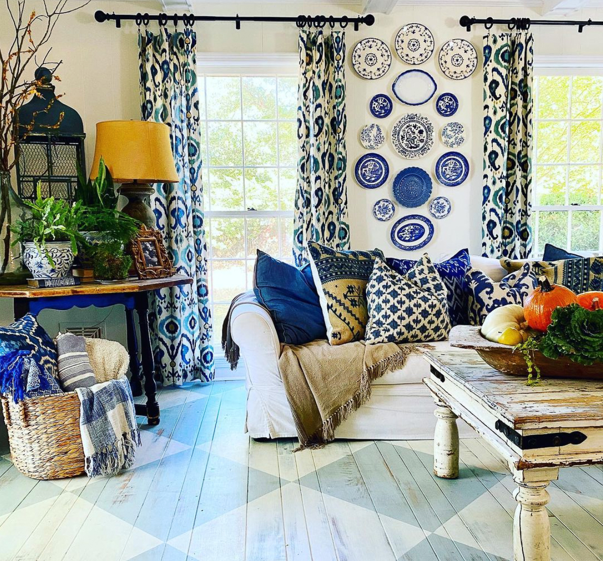 Love this soothing blue room with hand painted diamond pattered wood floors and beautiful plate wall