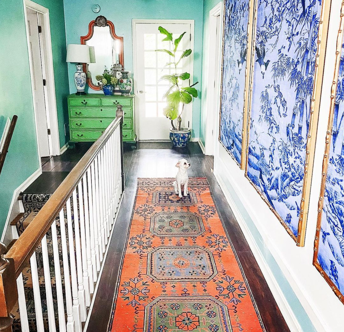 Colorful home with unique art and painted vintage furniture