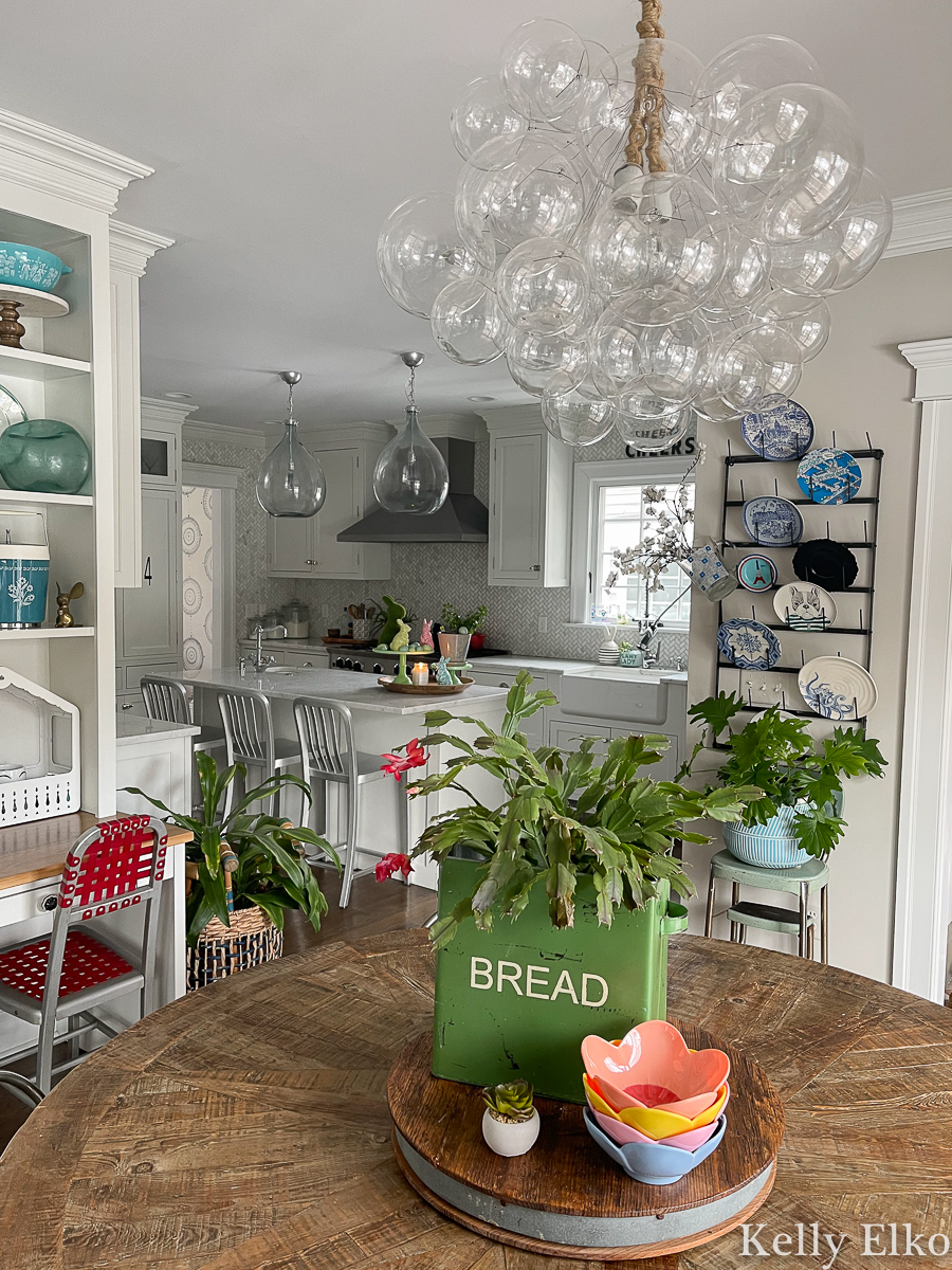 Eclectic spring home tour - love this bubble chandelier and her vintage displays kellyelko.com