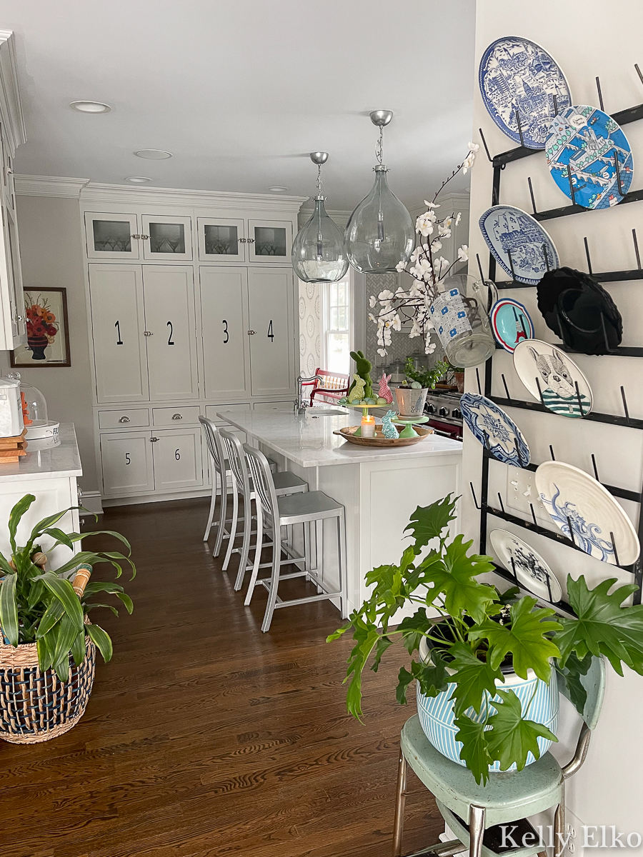 Beautiful white farmhouse kitchen with creative plate wall kellyelko.com