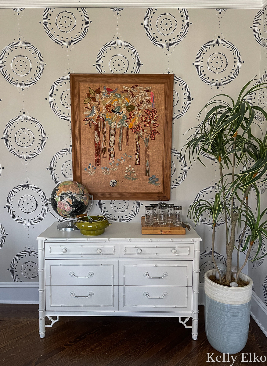 Beautiful vintage display in the dining room - love the huge crewel art kellyelko.com