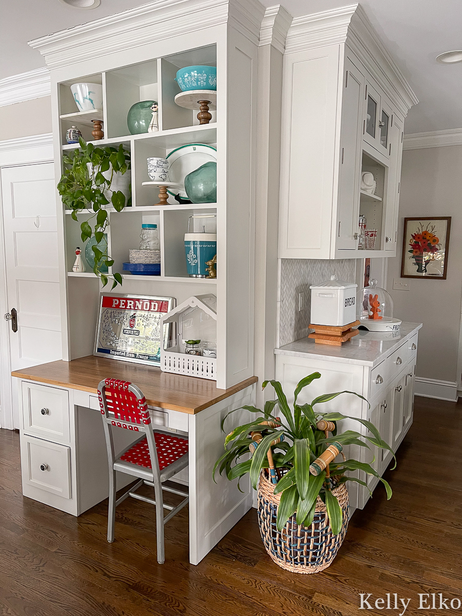 White kitchen with built in desk and open shelves kellyelko.com