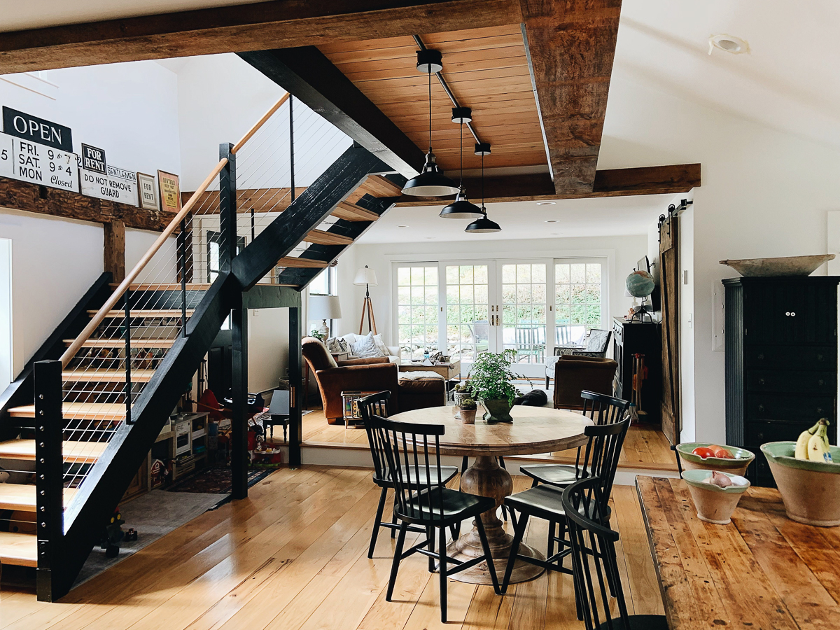 Beautiful modern staircase with wire banister in this modern farmhouse kellyelko.com