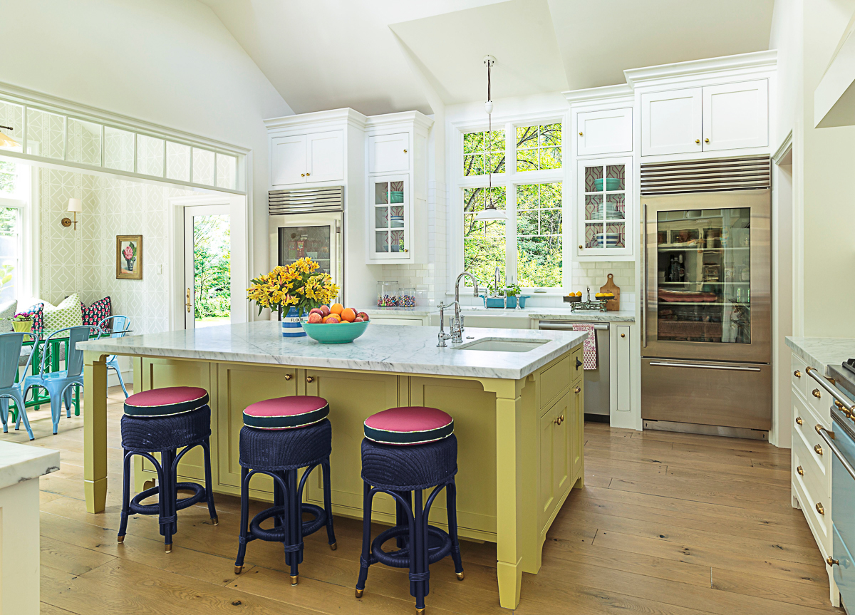 Eclectic Home Tour of Polished Farmhouse - love the yellow kitchen island and the glass front refrigerator kellyelko.com