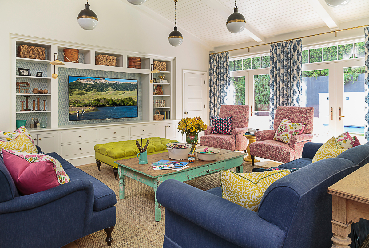 Colorful family room with built in bookcases kellyelko.com 