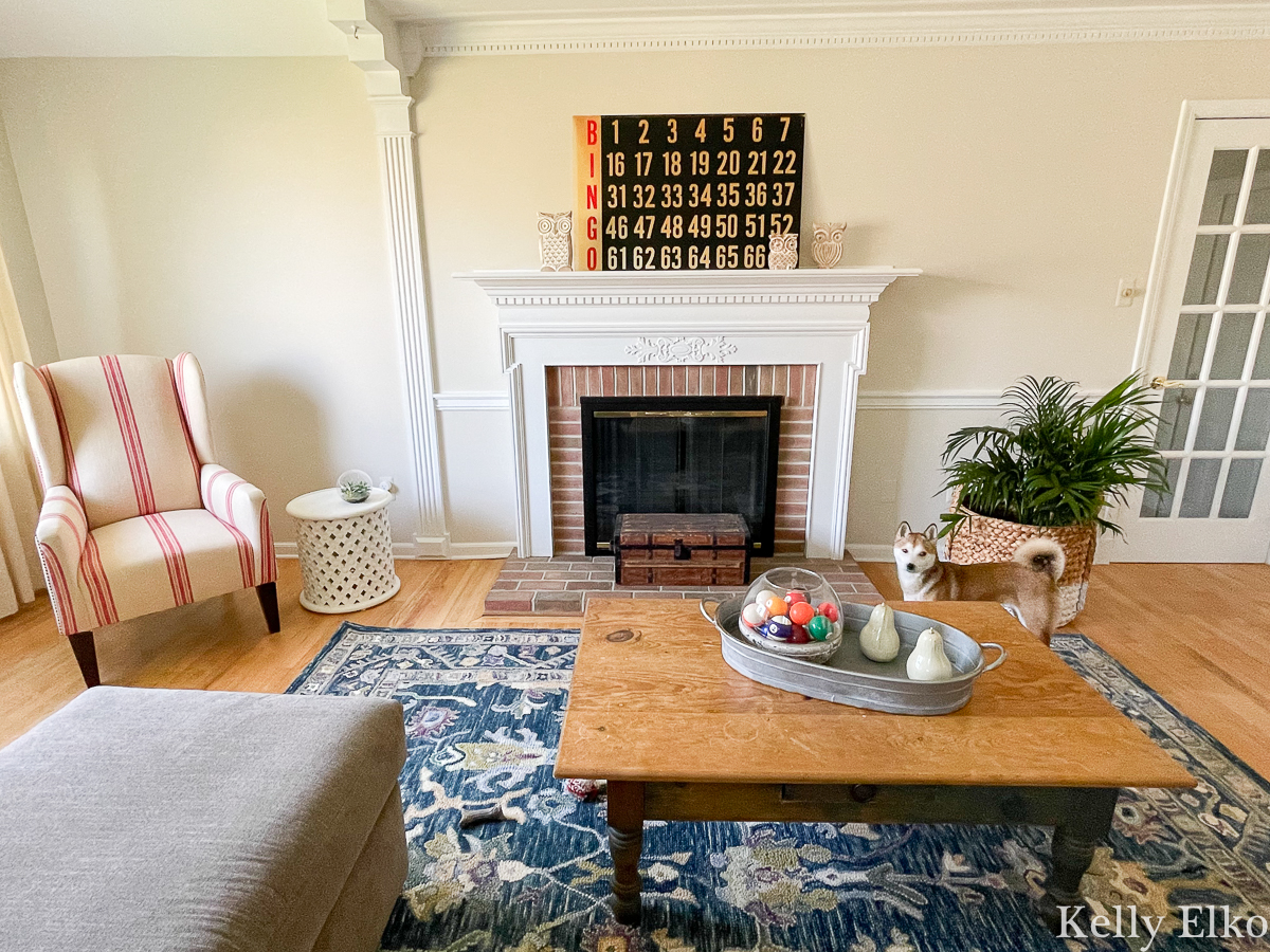 Home Staging After - love the colorful rug and vintage Bingo board on mantel kellyelko.com