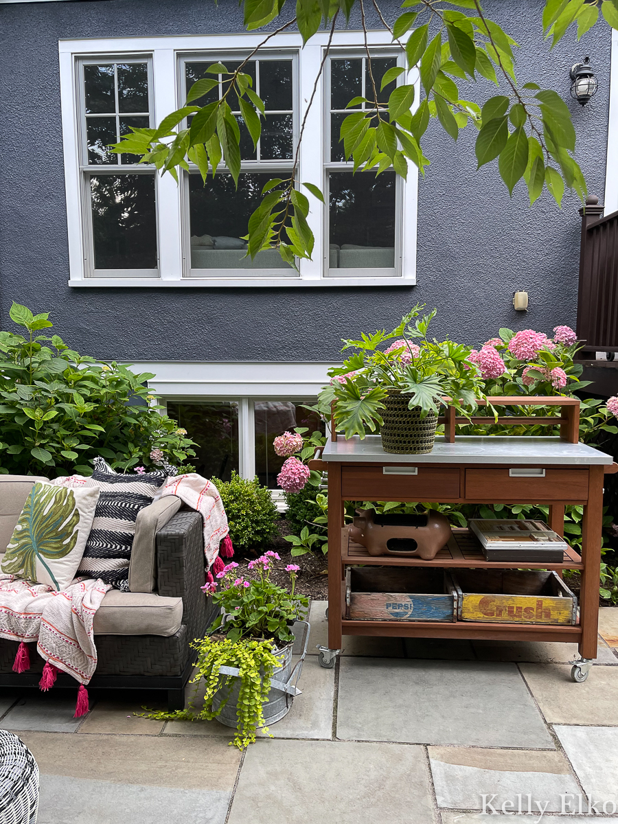 Love this potting bench turned bar cart on this stunning bluestone patio kellyelko.com