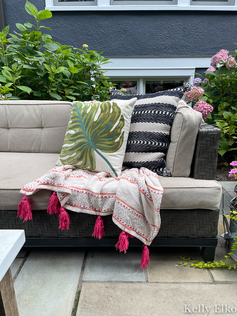 Colorful throw and outdoor pillows for an outdoor sofa kellyelko.com