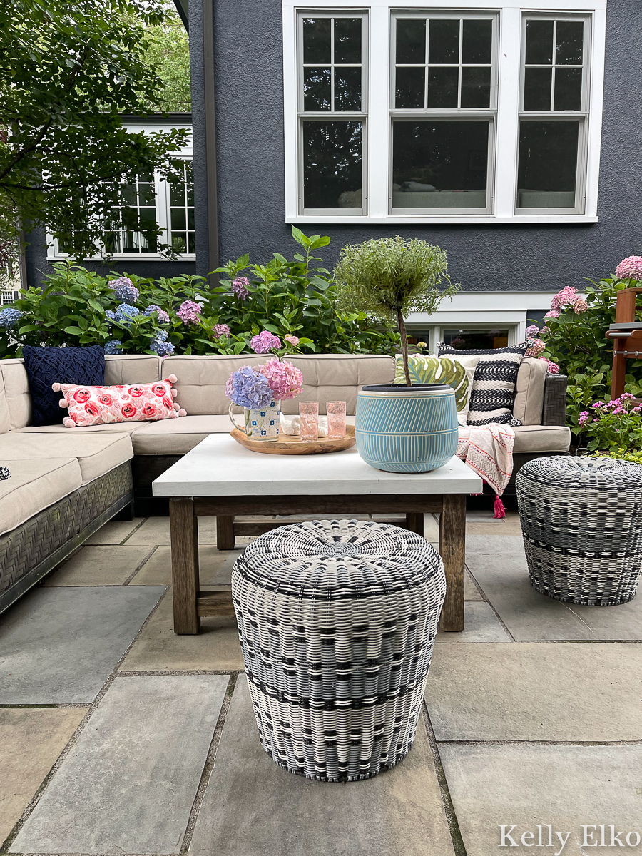 Love the outdoor sectional sofa and large coffee table in this stunning hydrangea filled backyard kellyelko.com