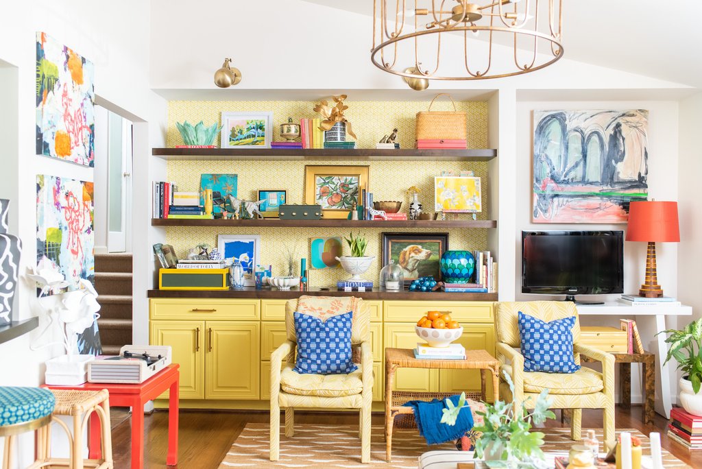 Eclectic and colorful family room with yellow built-ins and fun vintage collections kellyelkoi.com