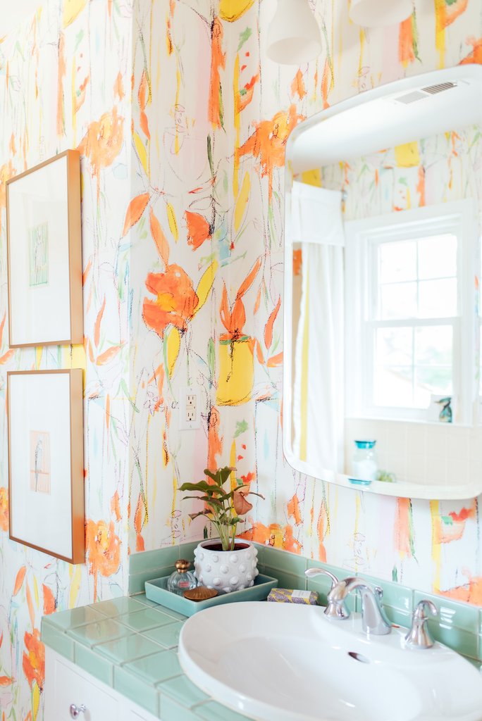 Add wallpaper to an outdated bathroom to focus the eye away from imperfections kellyelko.com