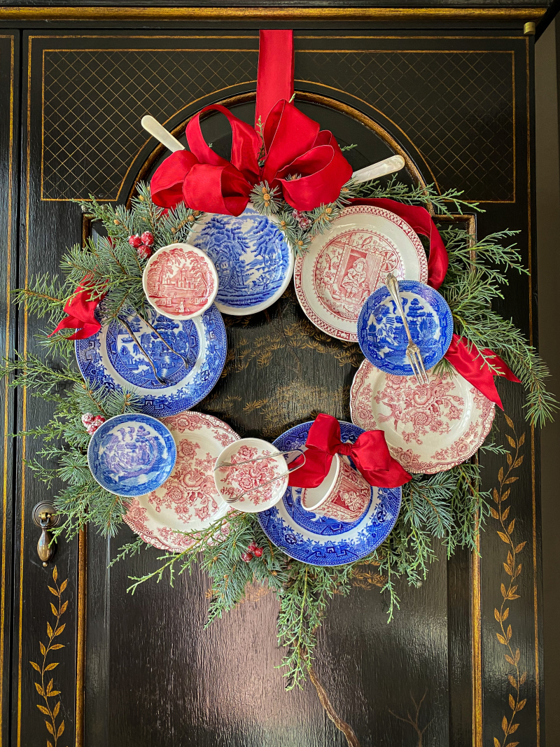 How to make a plate wreath - without damaging your precious plates! Love this blue and red plate wreath kellyelko.com