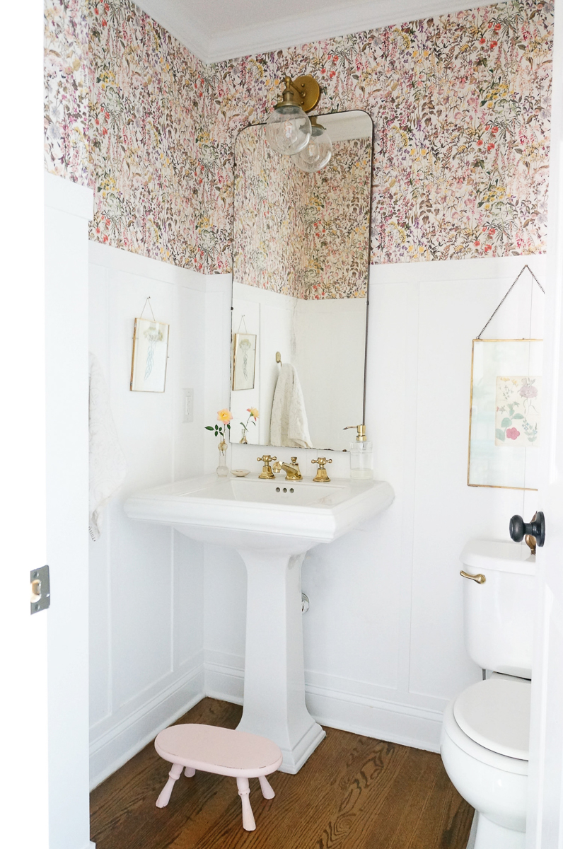 Powder room with floral wallpaper, wainscoting and brass lighting and fixtures kellyelko.com