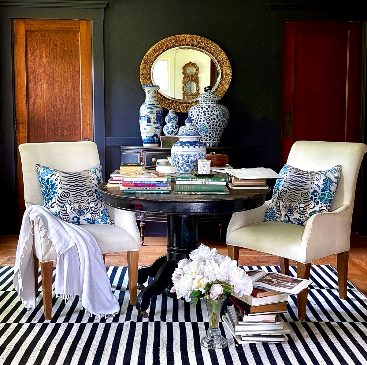 Love this library with antique round table and dark and moody paint kellyelko.com