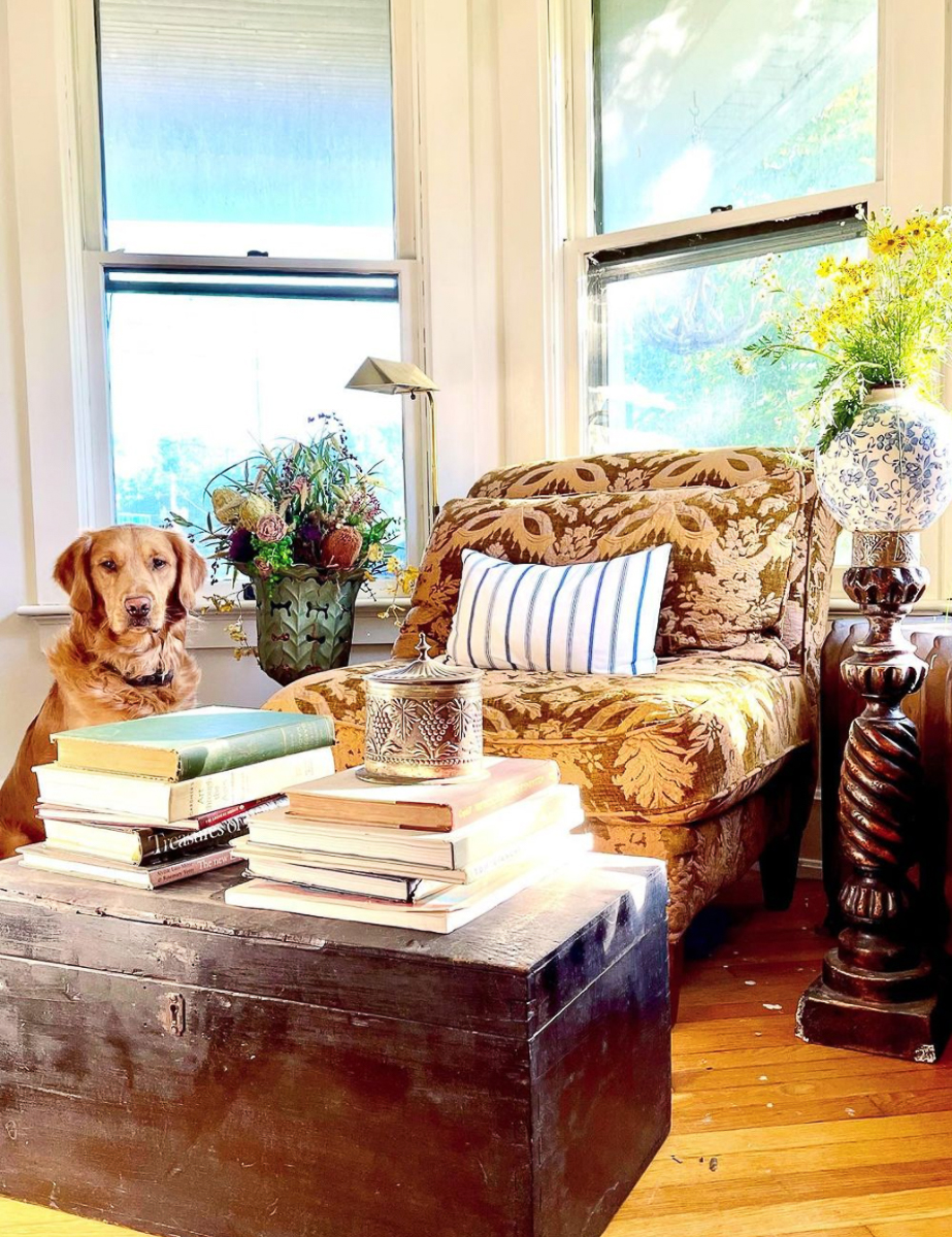 Cozy reading corner - love the old trunk piled high with books kellyelko.com