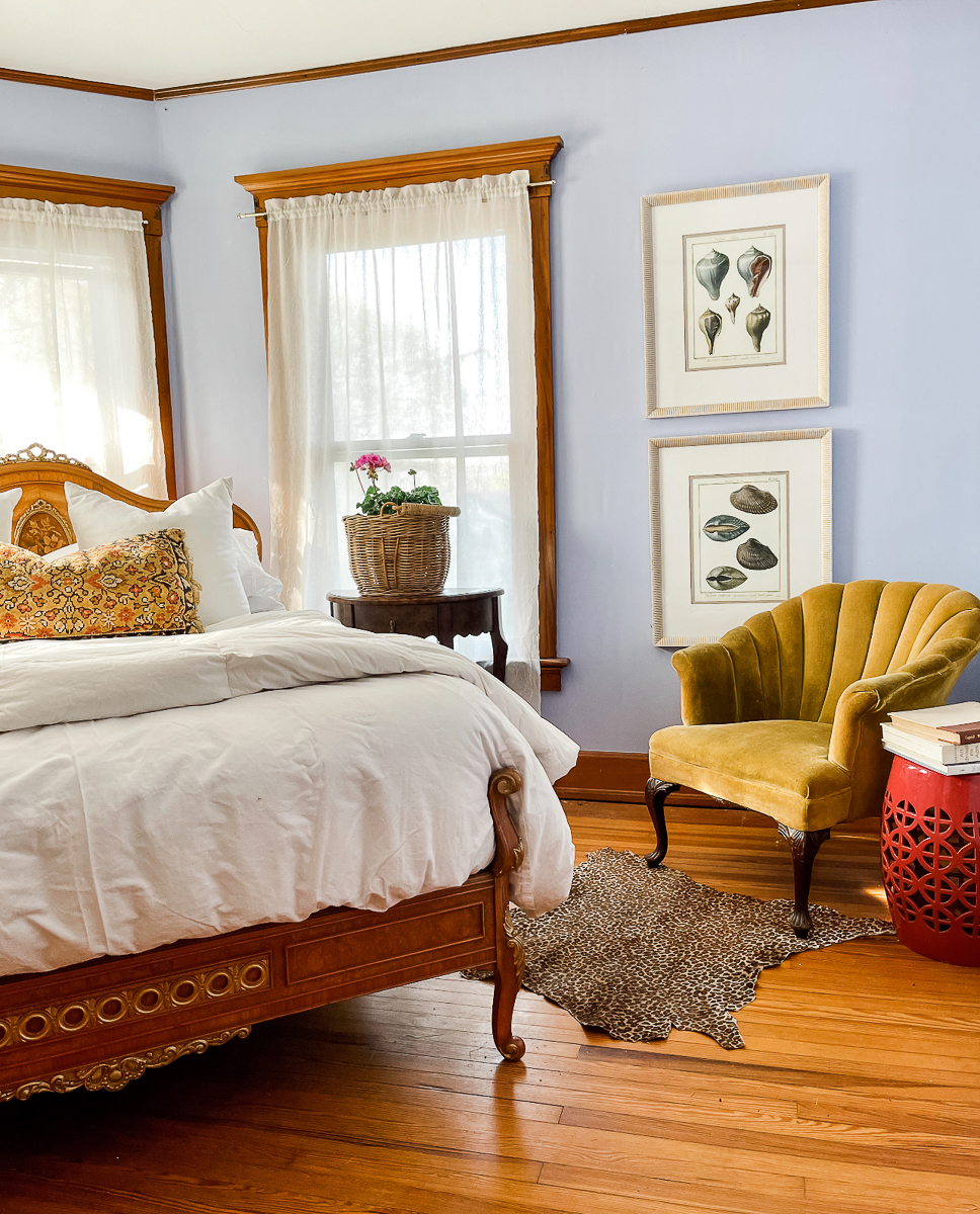 Grandmillennial bedroom filled with an eclectic mix of antiques including the stunning antique bed kellyelko.com