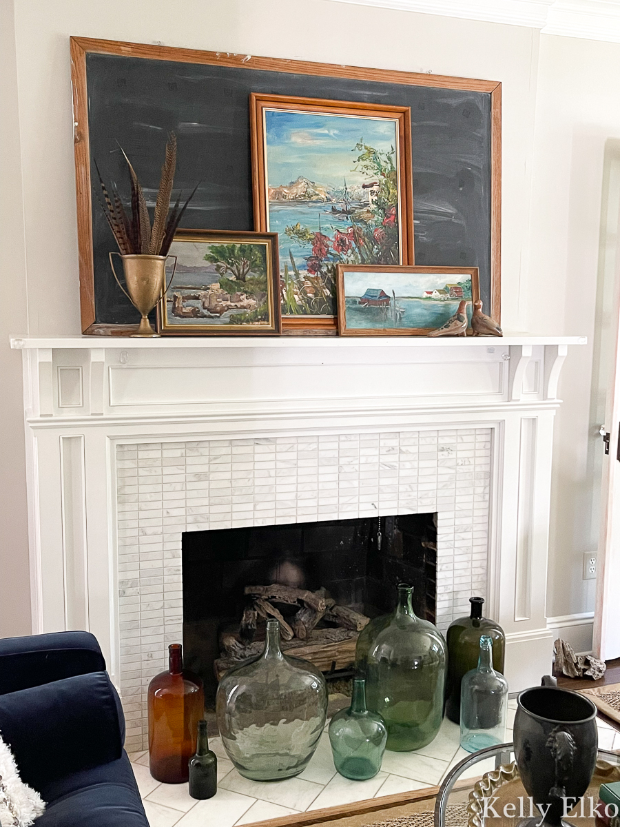 Stunning fall mantel with a trio of vintage seascapes and bottle collection kellyelko.com