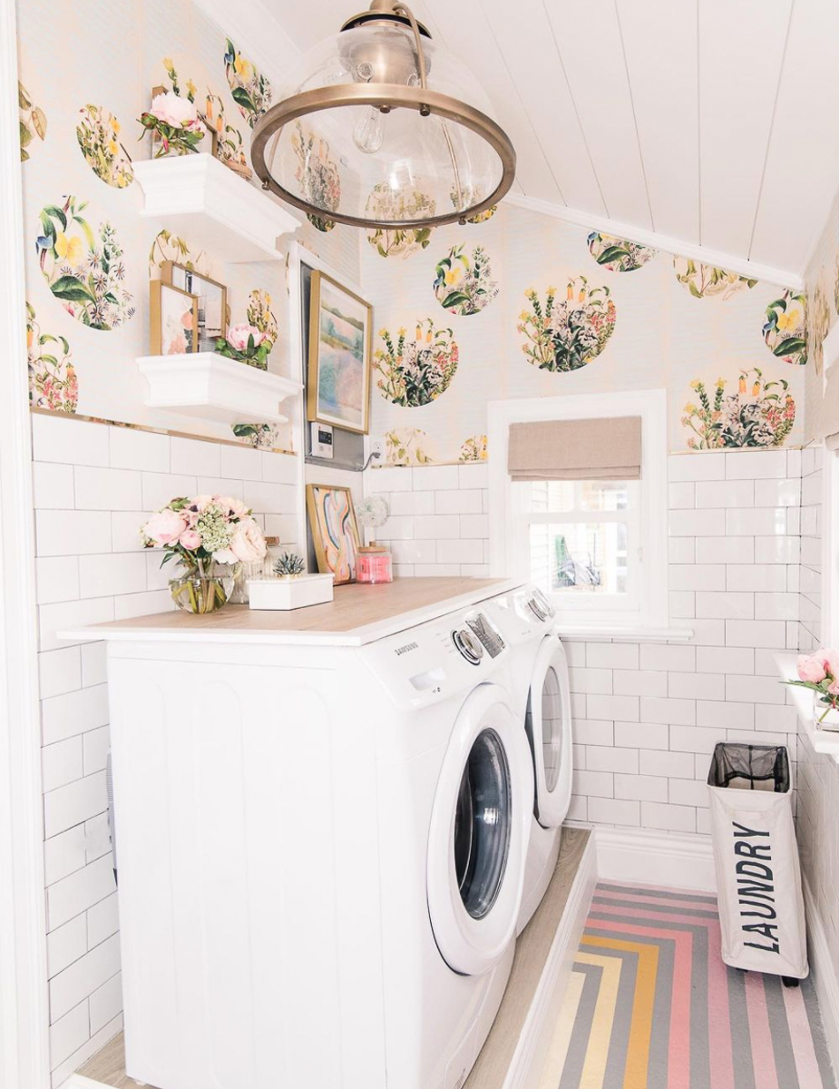 Love the wallpaper in this laundry room with subway tile and a rainbow stripe floor kellyelko.com