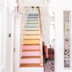 Eclectic Home Tour At Home with Ashley - love the rainbow painted stairs kellyelko.com
