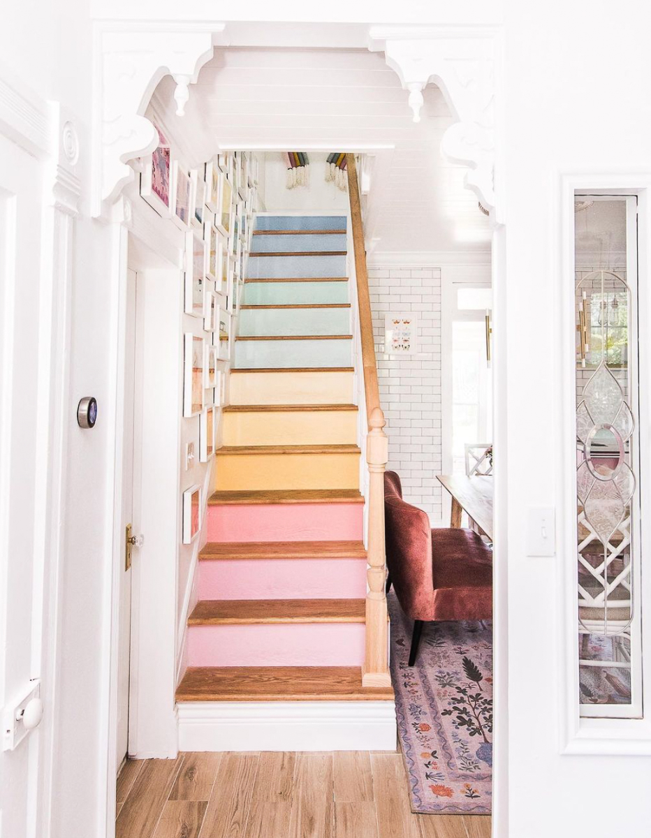 Love the rainbow stairs in this whimsical cottage home tour of At Home with Ashley kellyelko.com