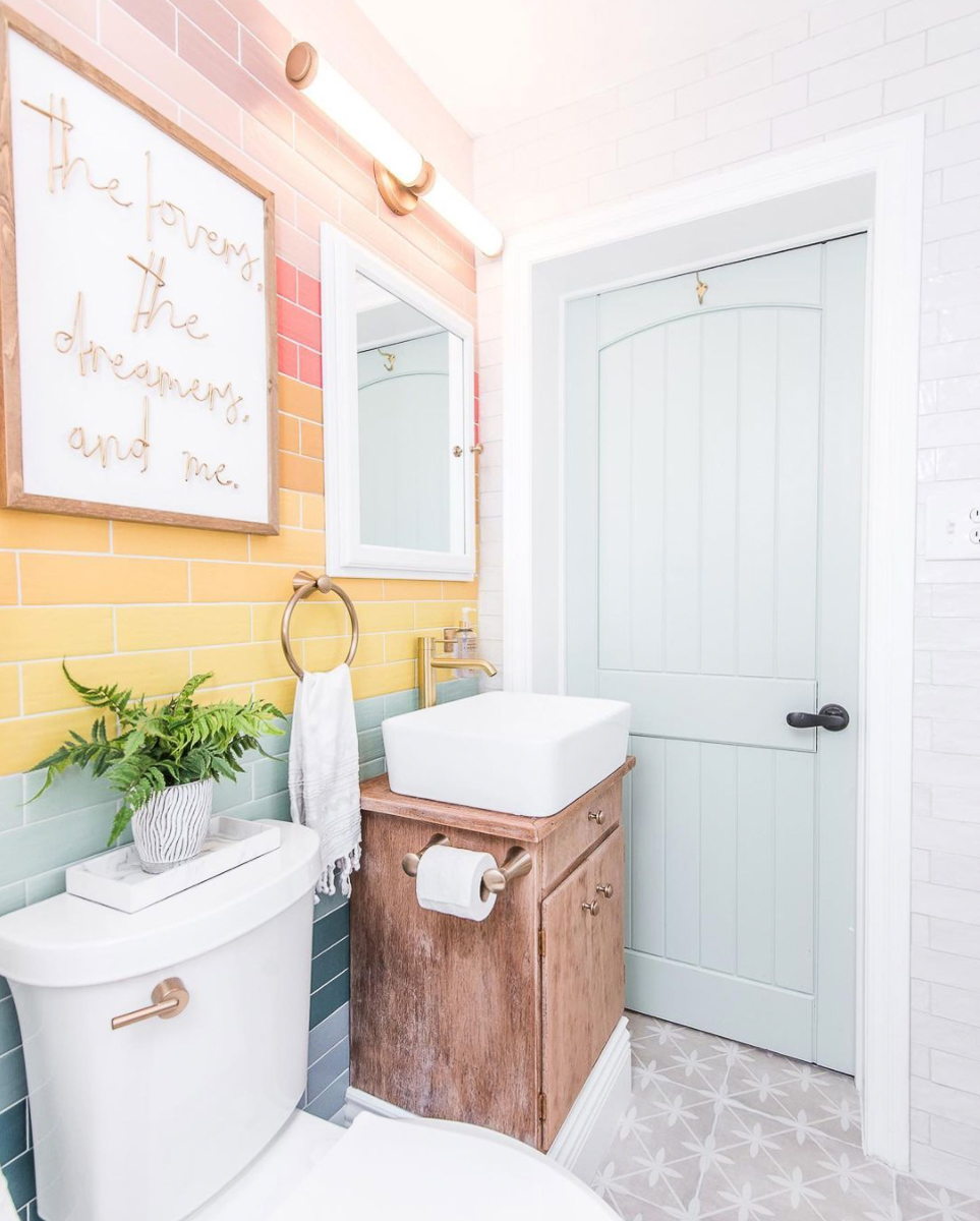 Love the way she laid the tile in a colorful rainbow pattern in this fun bathroom kellyelko.com