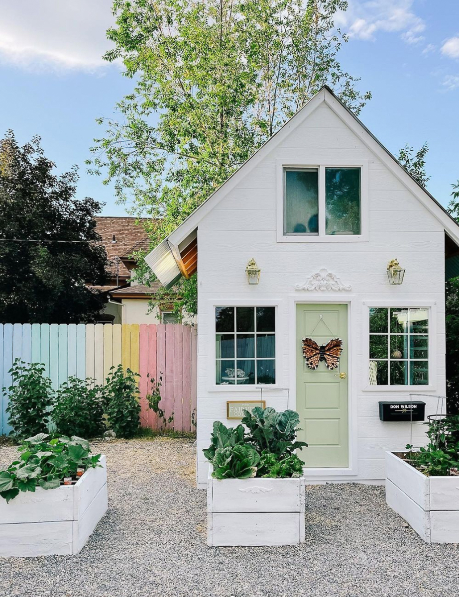 How adorable is this she shed and rainbow painted fence! kellyelko.com