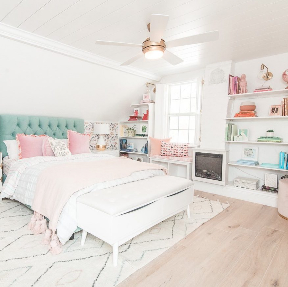 Beautiful white bedroom with colorful accessories and thrifted finds kellyelko.com