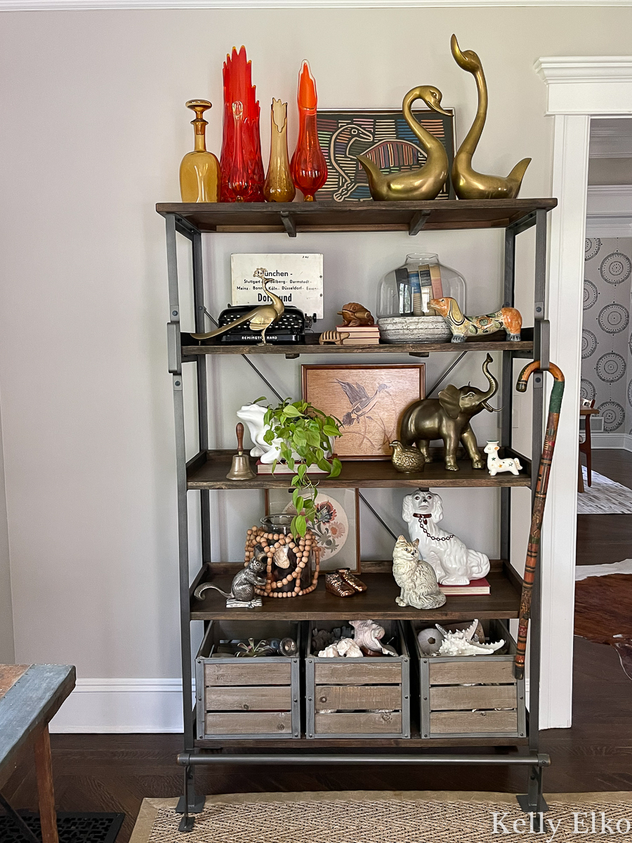 Shelf styling with vintage finds - love all the animal figurines and art kellyelko.com