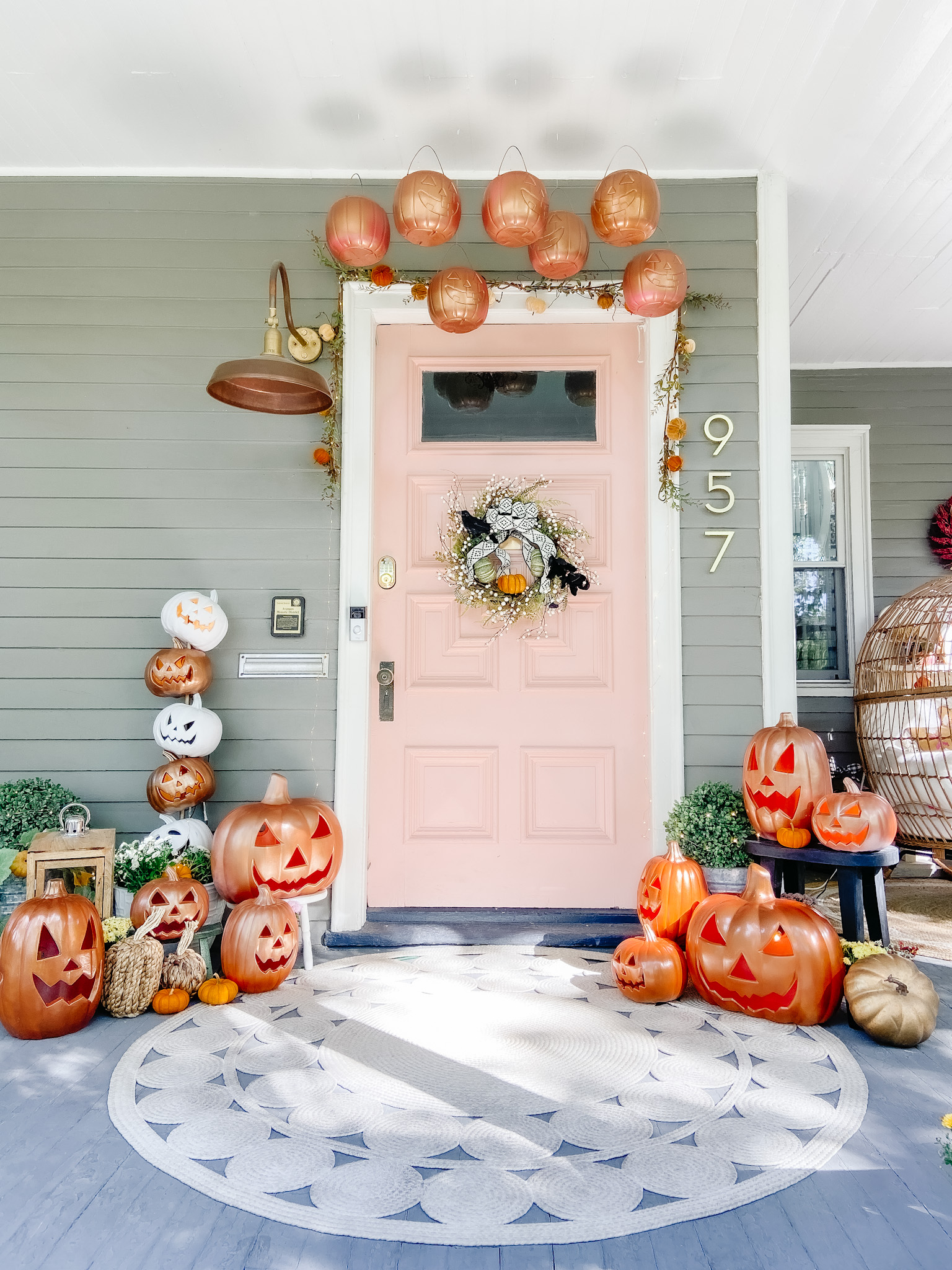 Extra Extra 4 - love this Great Pumpkin porch with copper spray painted jack o' lanterns kellyelko.com