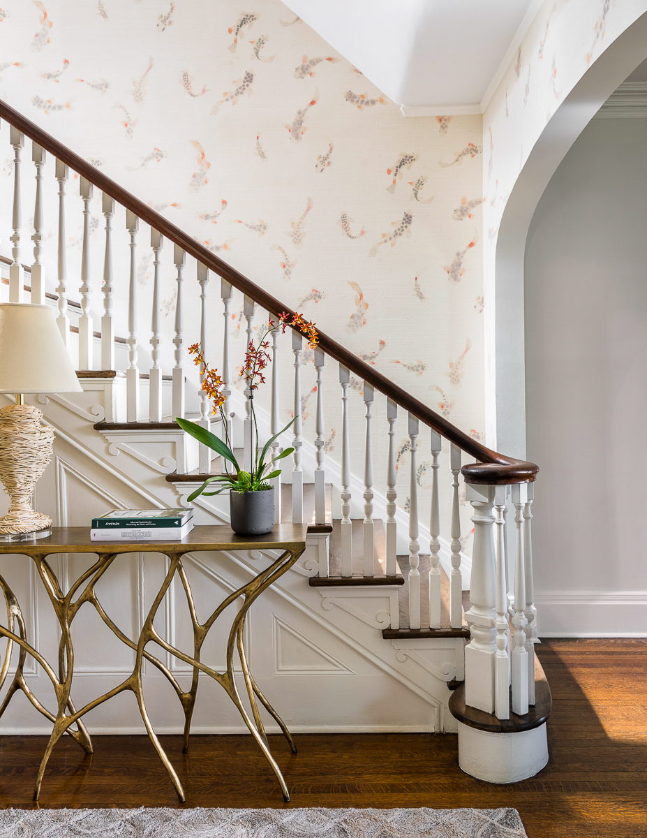 Stunning Koi wallpaper on the staircase wall of this old home kellyelko.com