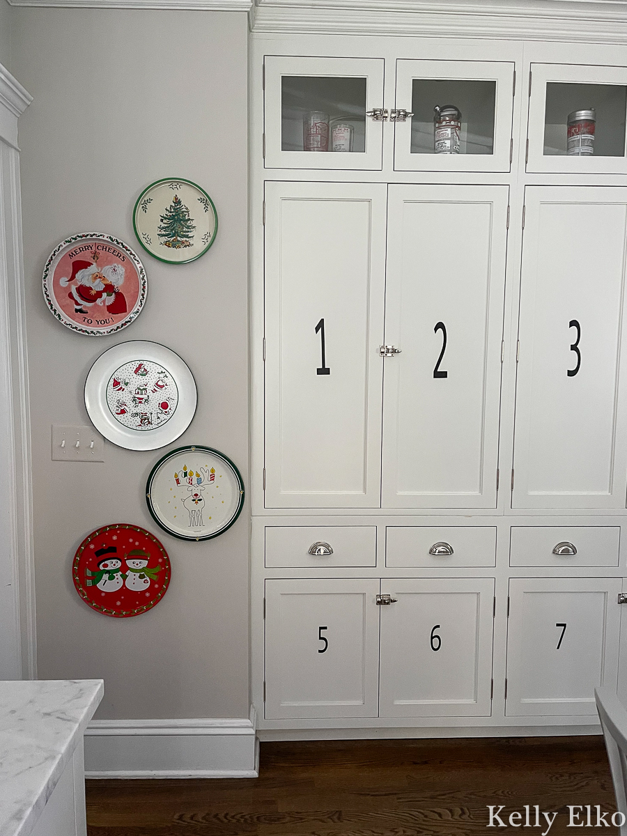 Love this vintage Christmas tray gallery wall in this farmhouse kitchen kellyelko.com