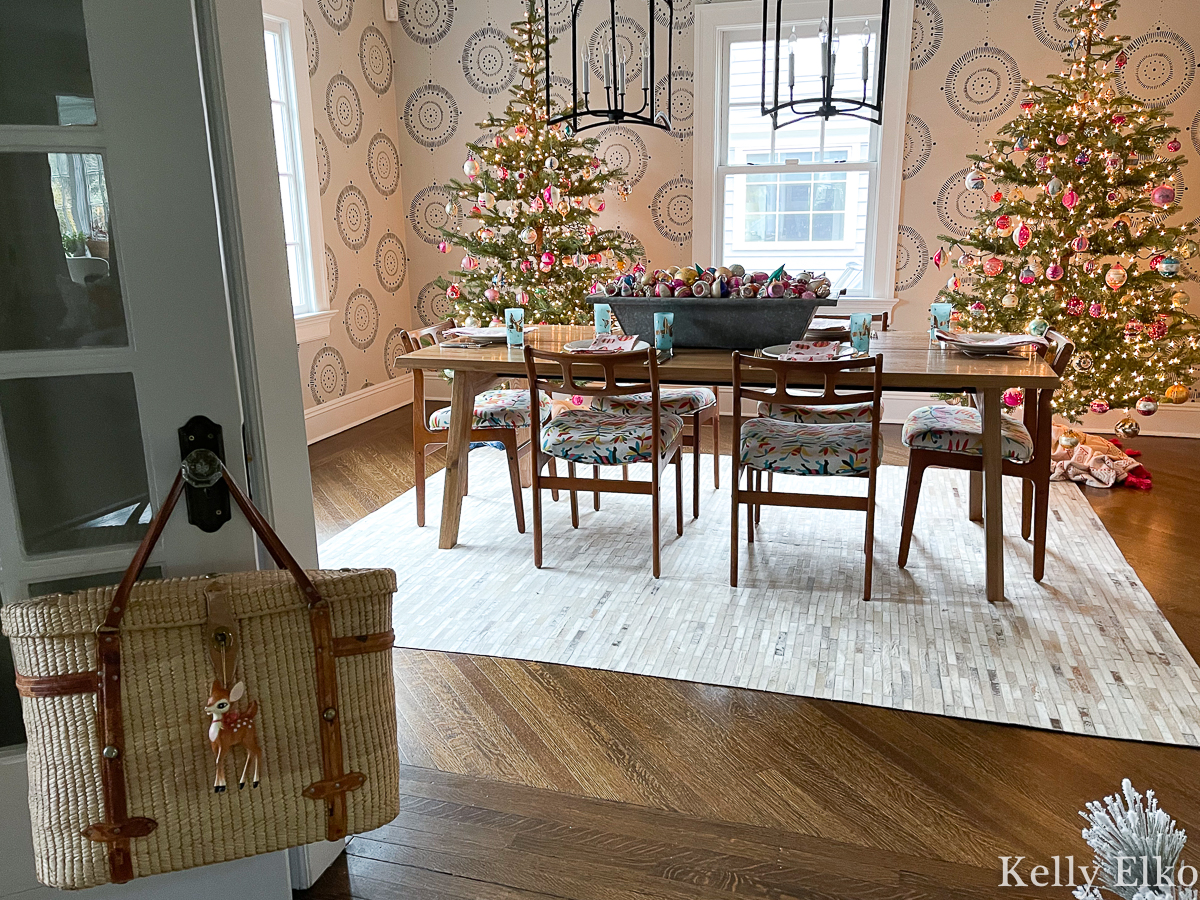 Beautiful Christmas dining room with a pair of sparse Christmas trees filled with vintage Shiny Brite ornaments kellyelko.com