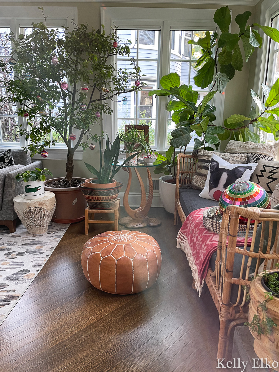 Beautiful sunroom decked out for Christmas - love the tree filled with vintage glass ornaments kellyelko.com