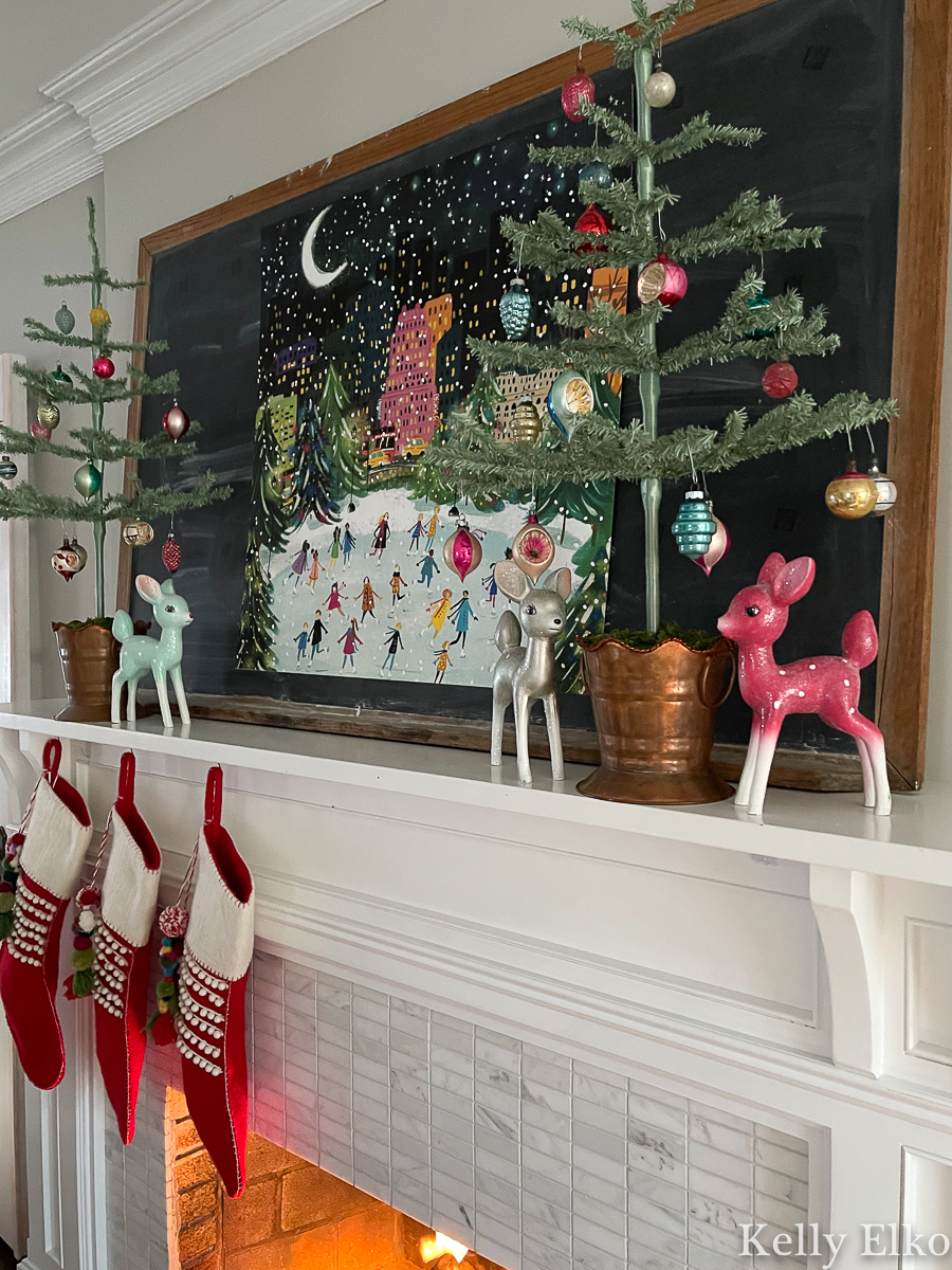 Love the feather trees with vintage Shiny Brite ornaments on this colorful Christmas mantel kellyelko.com 